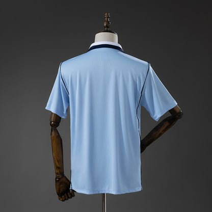 CAMISETA SELECCIÓN URUGUAY LOCAL MUNDIAL 2026 TIPO HINCHA